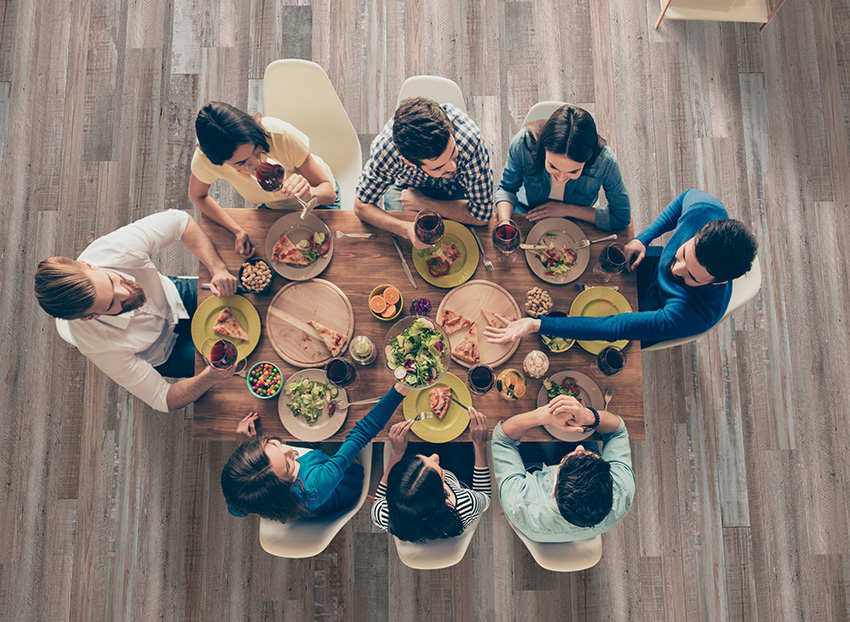 Coles Fine Flooring | friends eating dinner on cali vinyl