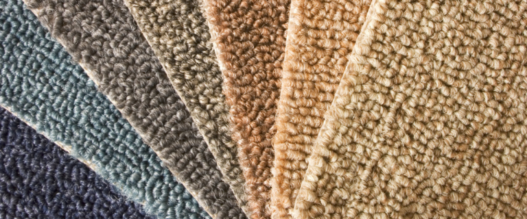 Multiple carpet squares of varying colors from blue to beige